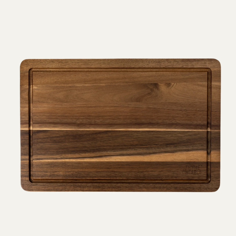 Wooden cutting board on a white background