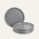 A set of four slate grey salad plates with gold trim, stacked in a 3-1-1 pattern.
